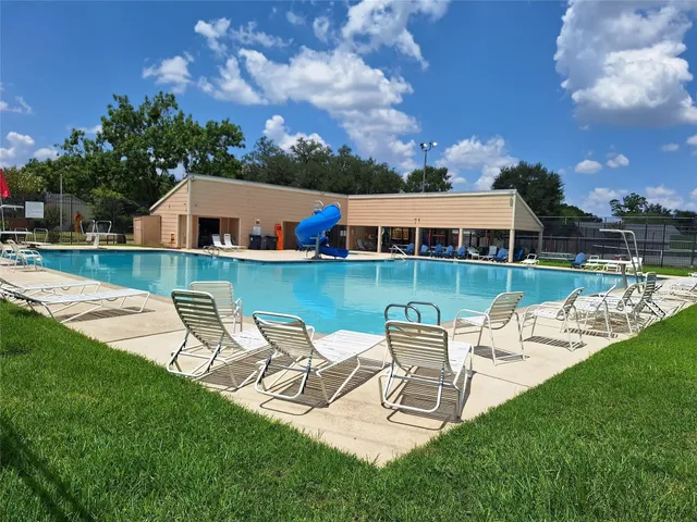 a view of a slide with sitting area