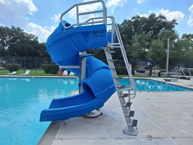 a view of a backyard with sitting area and fire pit