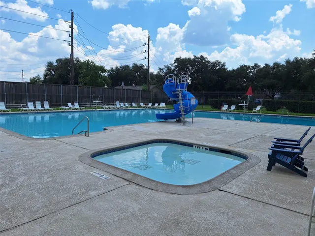 a view of outdoor space with playground and green space