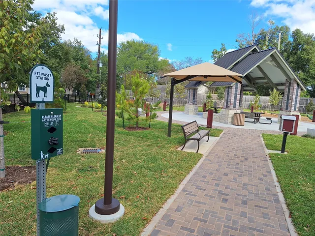a house view with a sitting space fire pit and outdoor seating