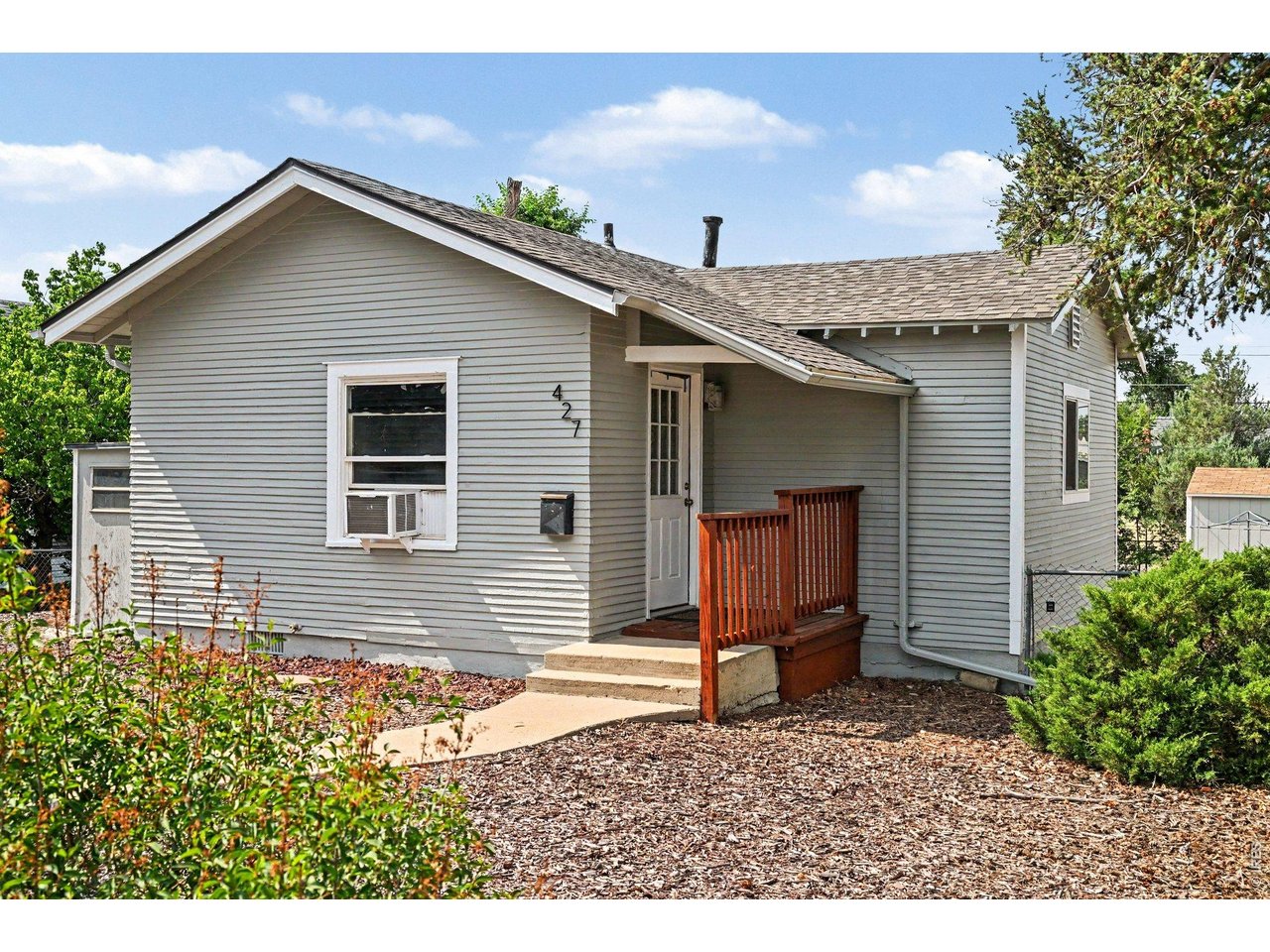 427 9th Street Greeley, CO 80631 - Photo 4 of 22 a view of a house with a yard