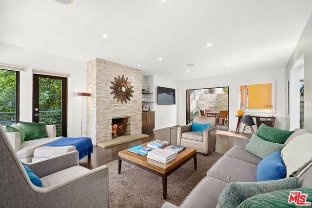 a view of deck with furniture and trees