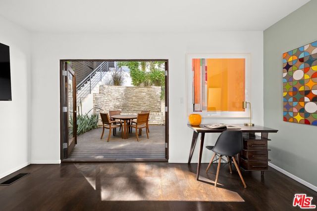 a view of a chairs and table in the patio