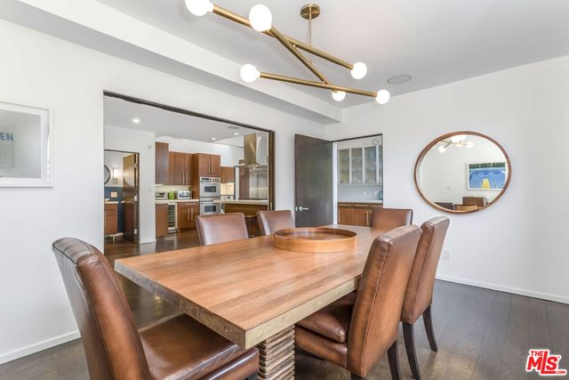 a view of a chairs and table in a balcony