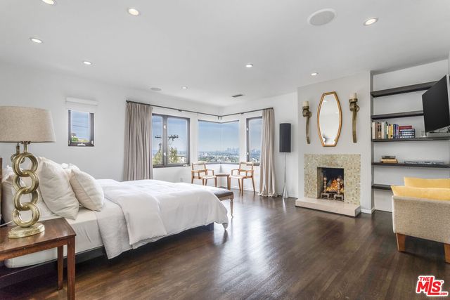 a bedroom with bed and a table