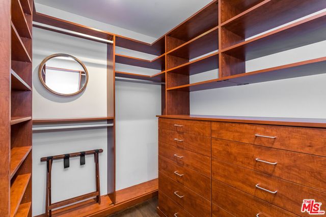 a bathroom with a toilet a sink and a mirror