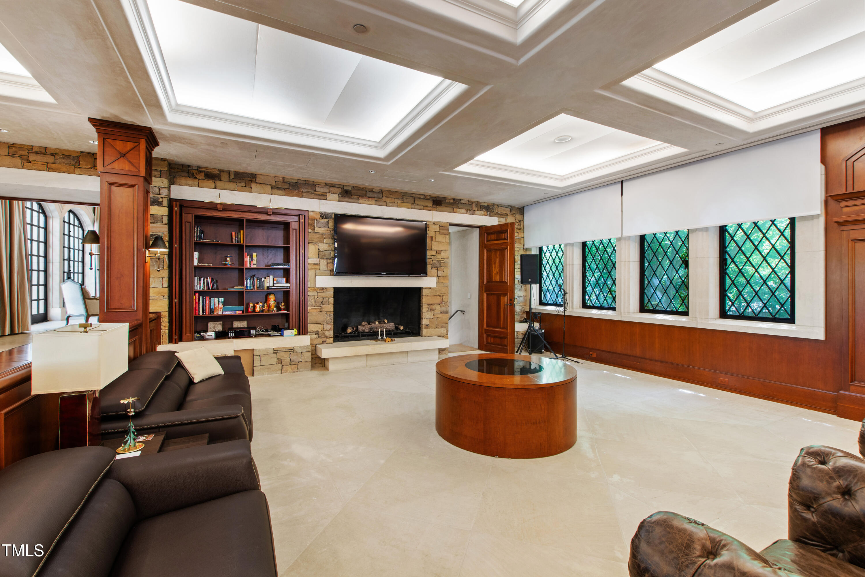 6510 New Market Way Raleigh, NC 27615 - Photo 36 of 95 a living room with furniture a large window and a fireplace