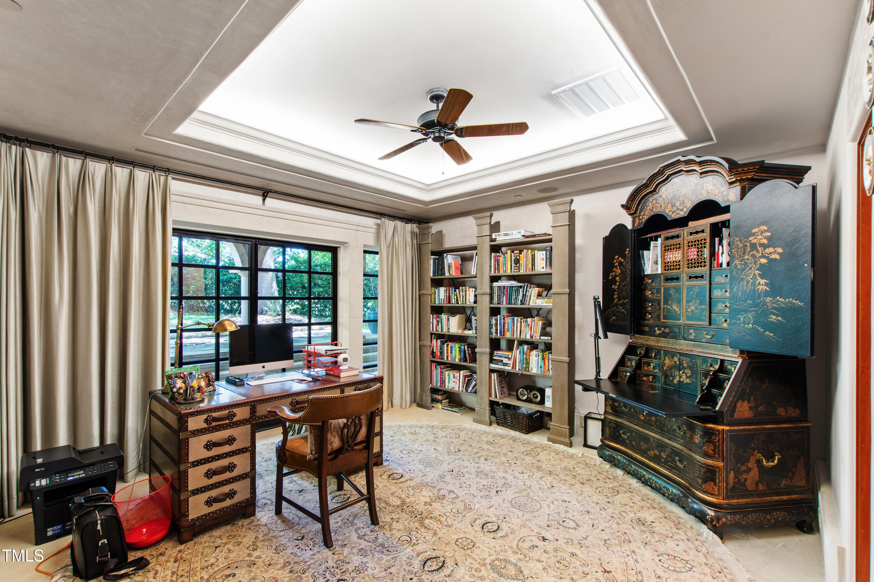 6510 New Market Way Raleigh, NC 27615 - Photo 47 of 95 a living room with furniture a flat screen tv and a floor to ceiling window