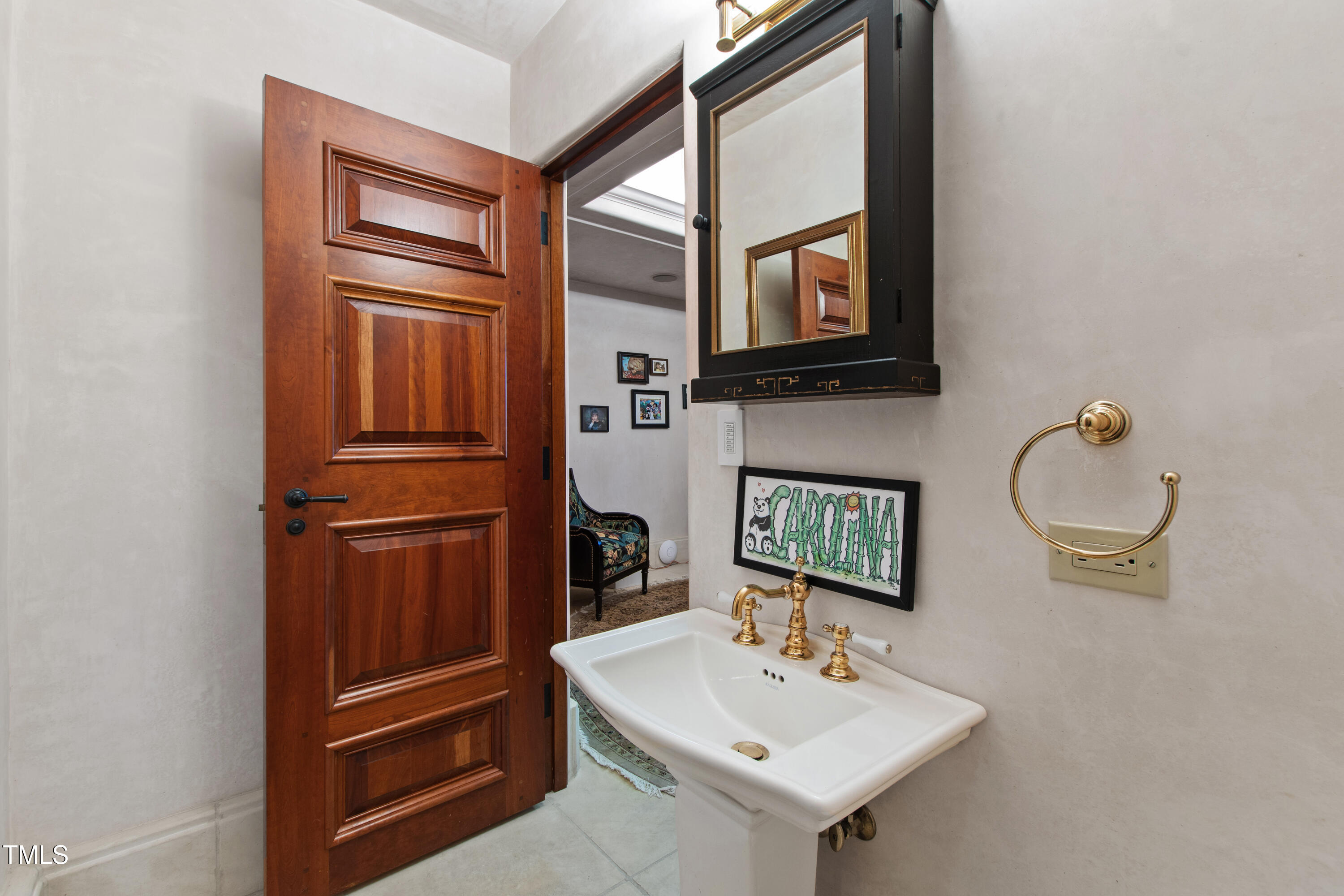 6510 New Market Way Raleigh, NC 27615 - Photo 48 of 95 a bathroom with a sink a mirror and a toilet