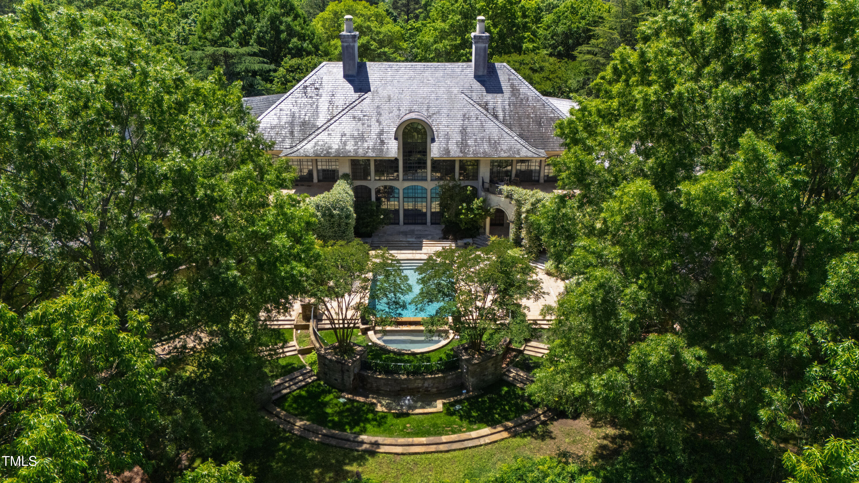 6510 New Market Way Raleigh, NC 27615 - Photo 5 of 95 a aerial view of a house with a yard and large trees