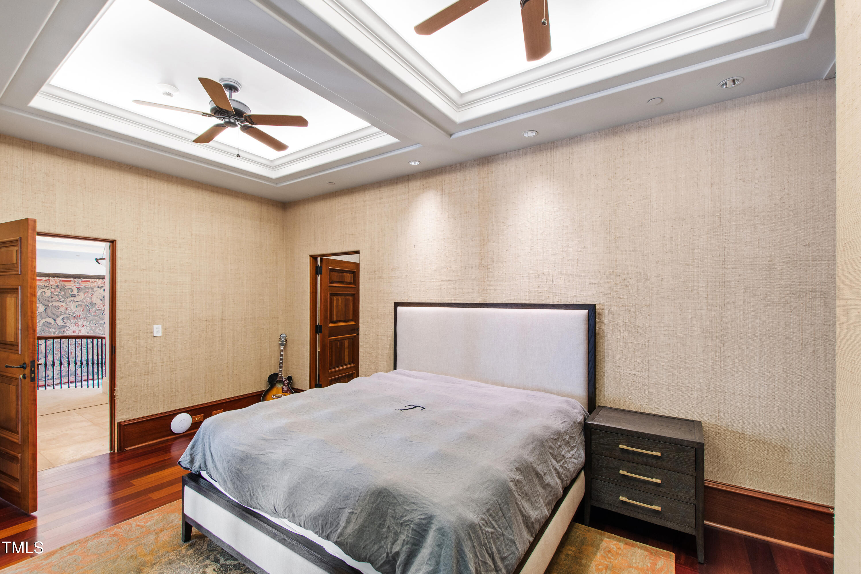 6510 New Market Way Raleigh, NC 27615 - Photo 53 of 95 a bedroom with a bed and wooden floor