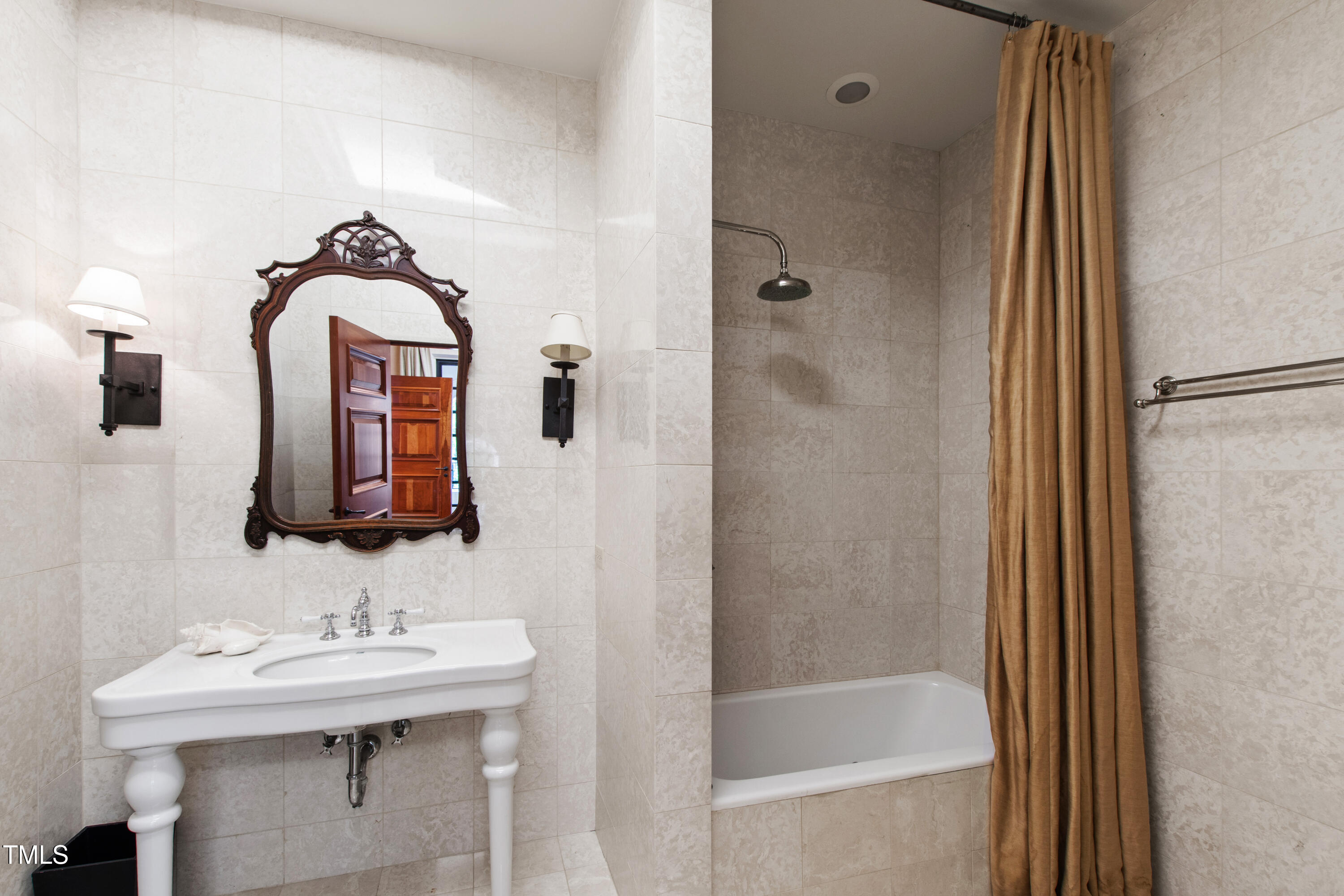 6510 New Market Way Raleigh, NC 27615 - Photo 55 of 95 a bathroom with a sink and a mirror