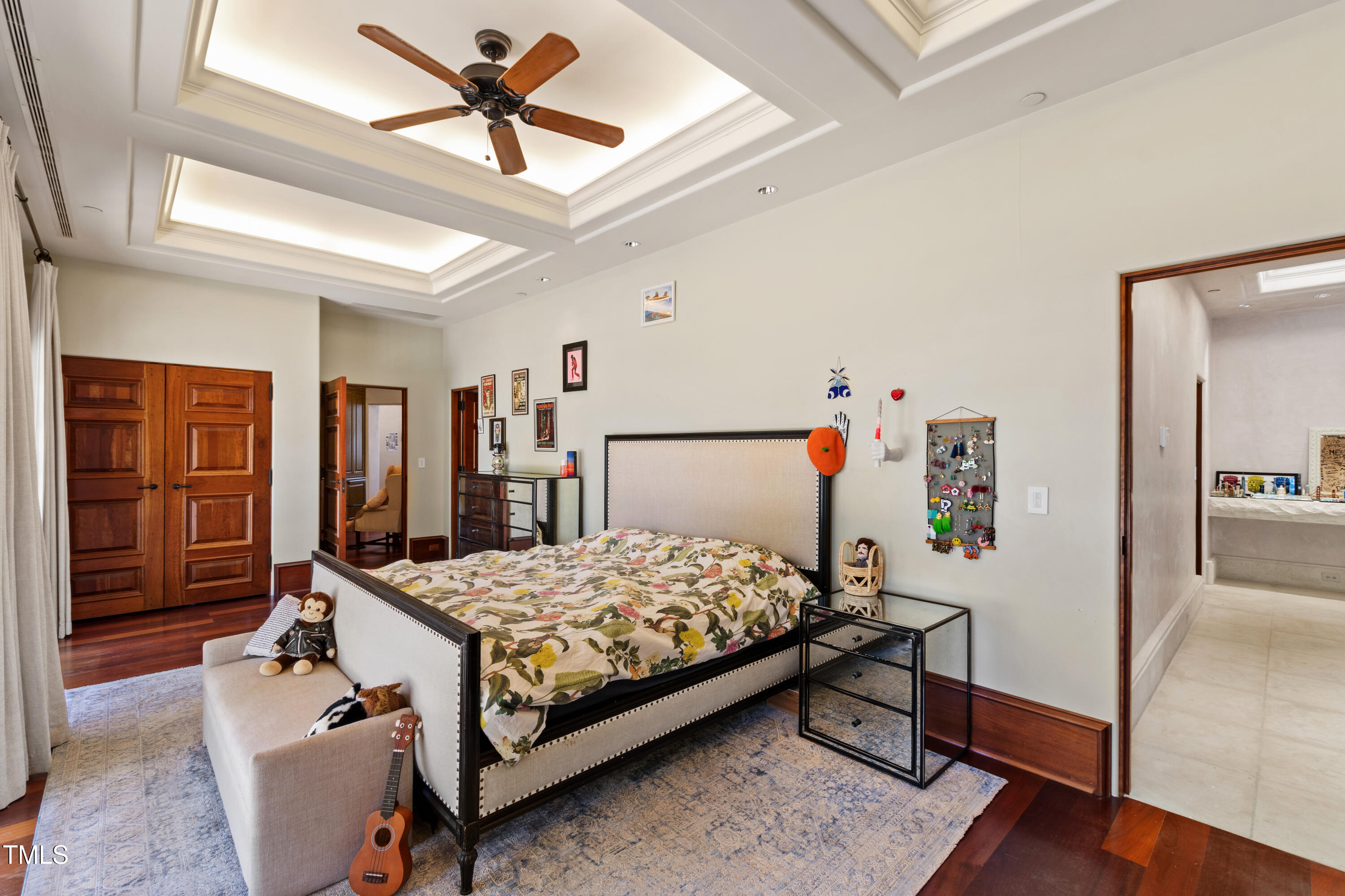 6510 New Market Way Raleigh, NC 27615 - Photo 57 of 95 a bedroom with a bed and a walk in closet