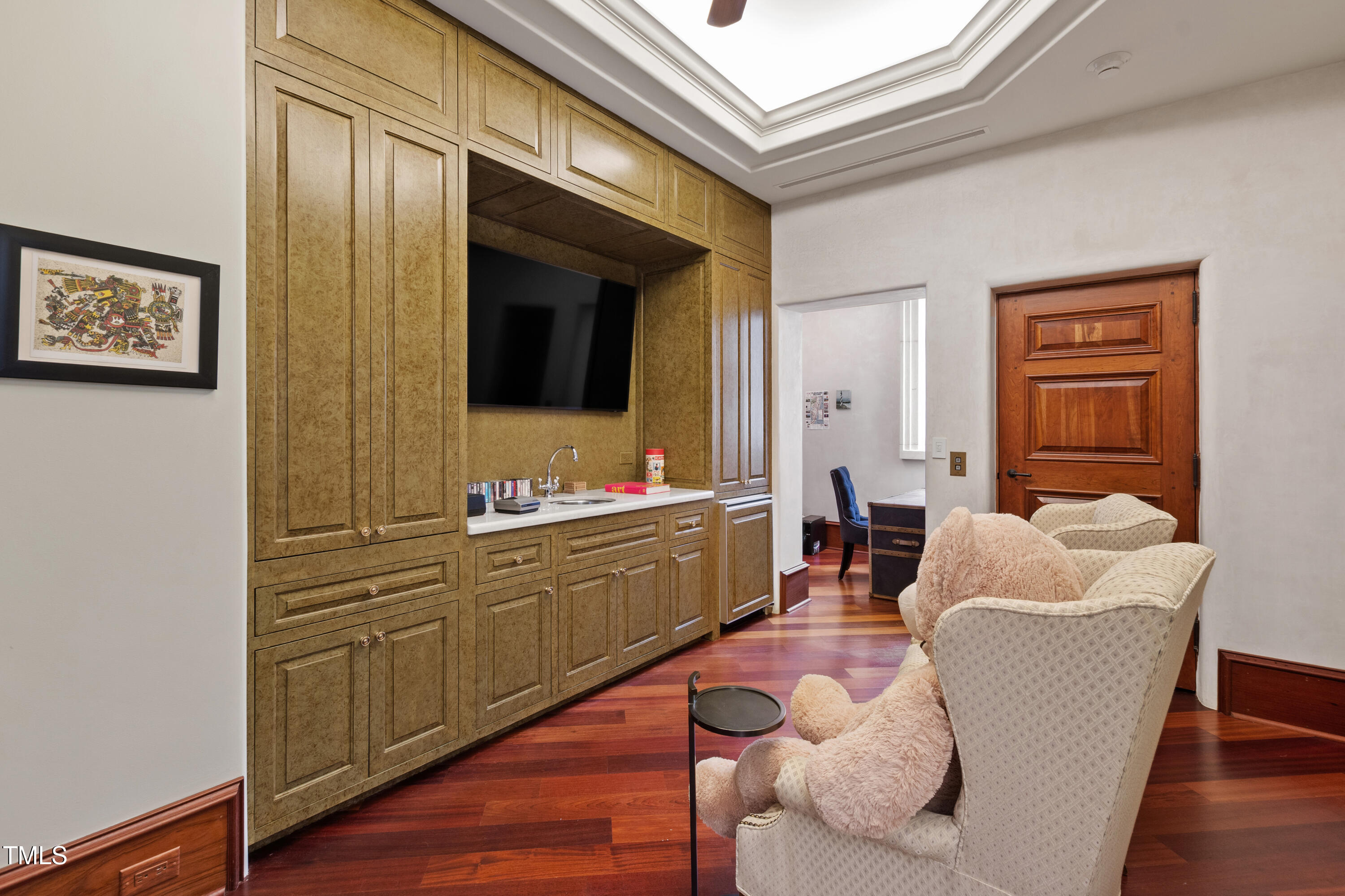 6510 New Market Way Raleigh, NC 27615 - Photo 59 of 95 a living room with furniture and a flat screen tv