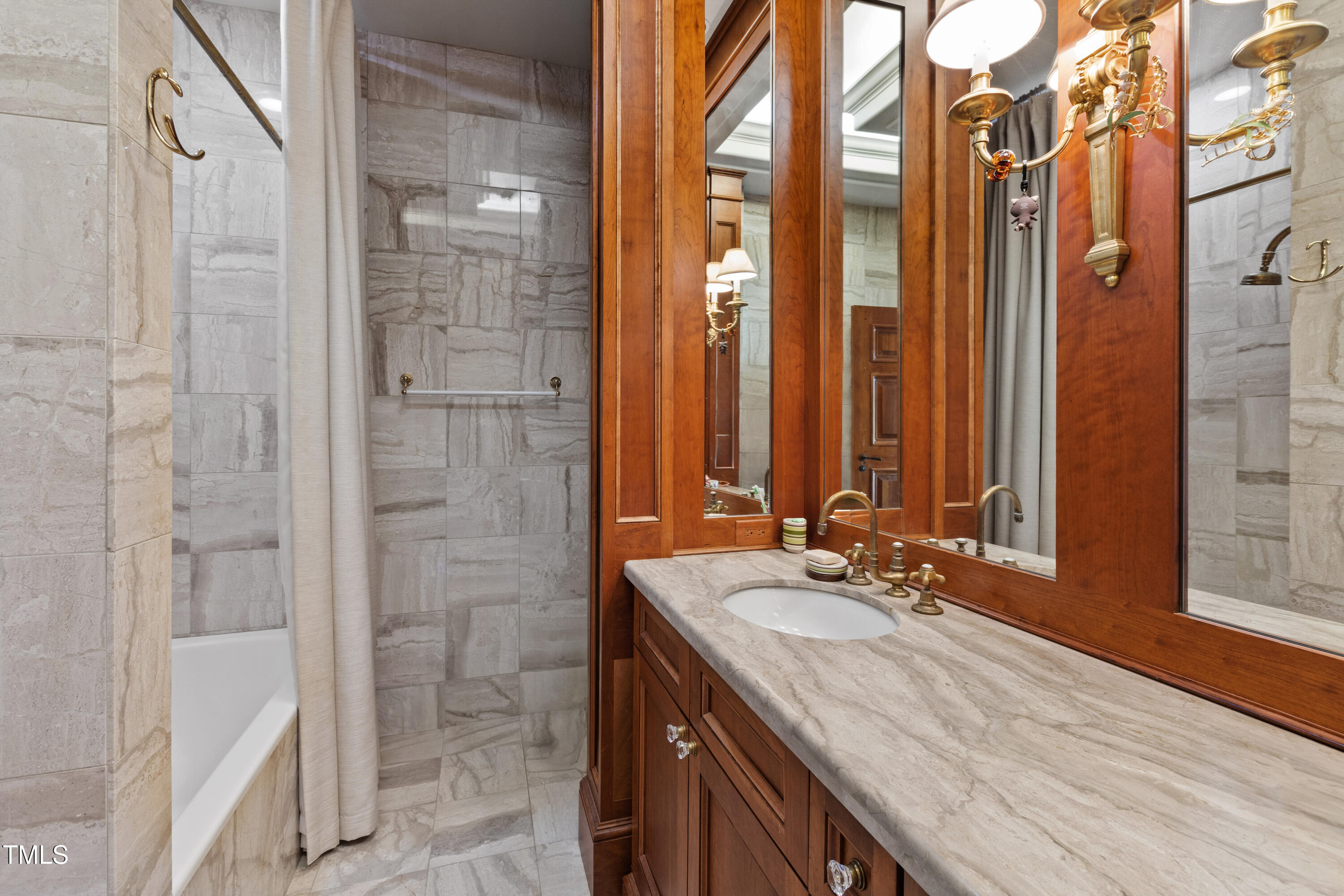 6510 New Market Way Raleigh, NC 27615 - Photo 66 of 95 a bathroom with a granite countertop sink and a mirror