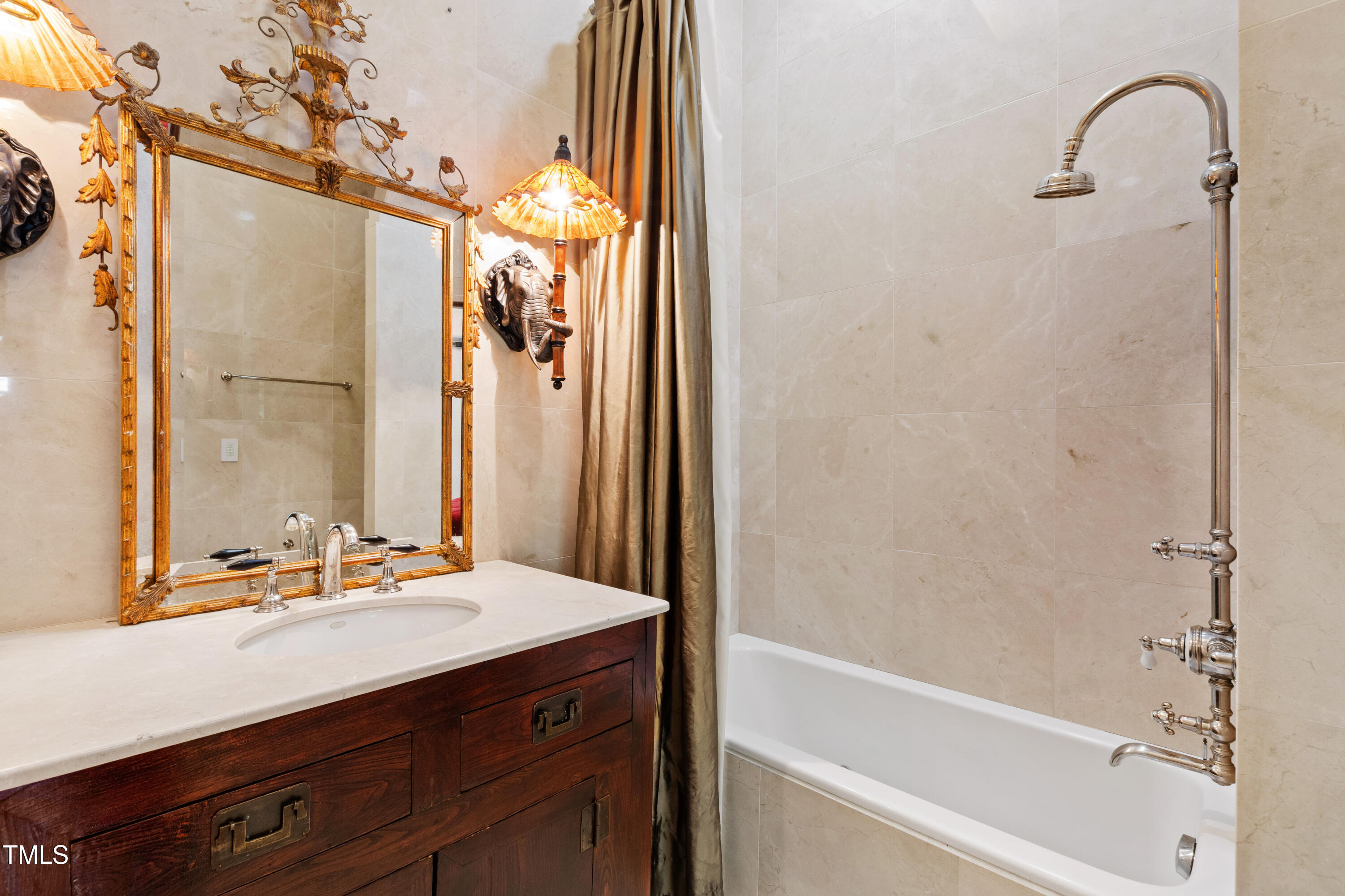 6510 New Market Way Raleigh, NC 27615 - Photo 77 of 95 a bathroom with a bathtub and a sink