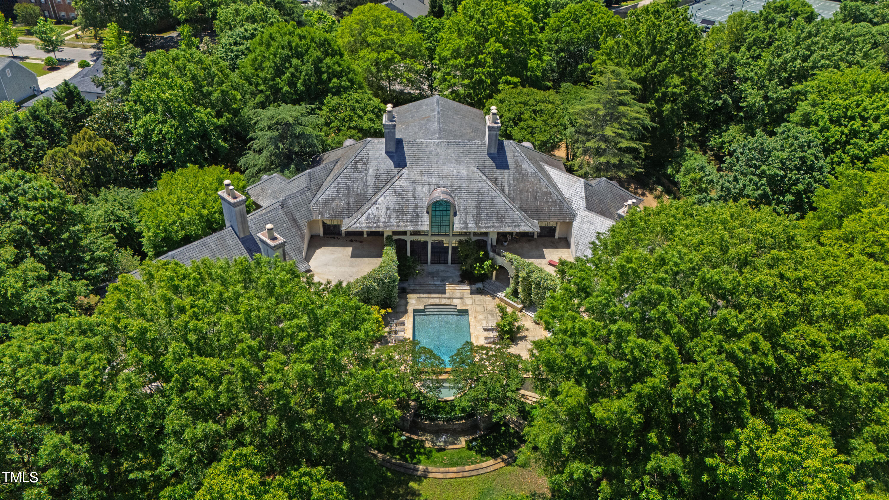 6510 New Market Way Raleigh, NC 27615 - Photo 94 of 95 a aerial view of a house with a yard and large trees