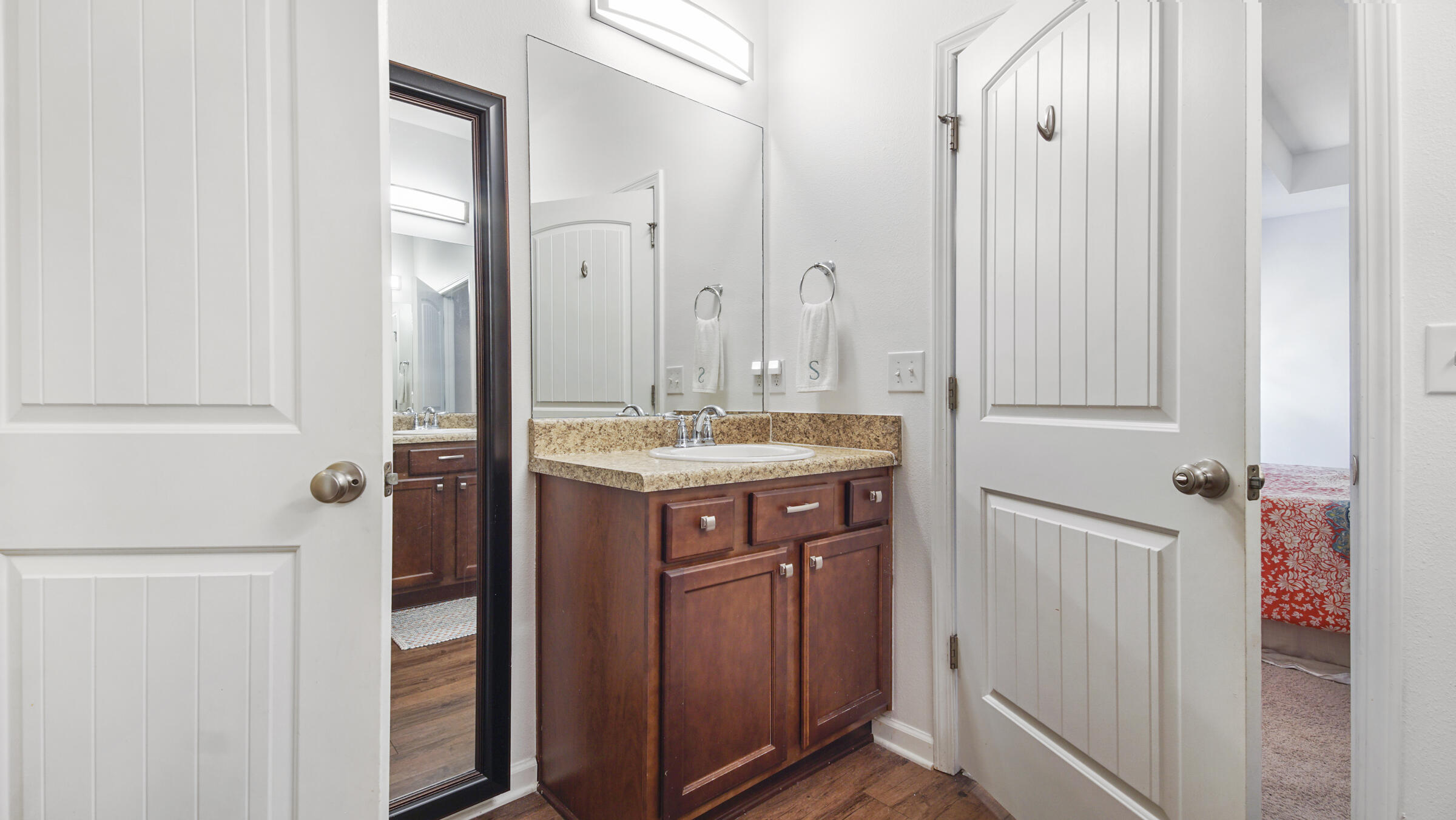 237 Nelly Street Freeport, FL 32439 - Photo 13 of 42 a bathroom with a sink and a mirror