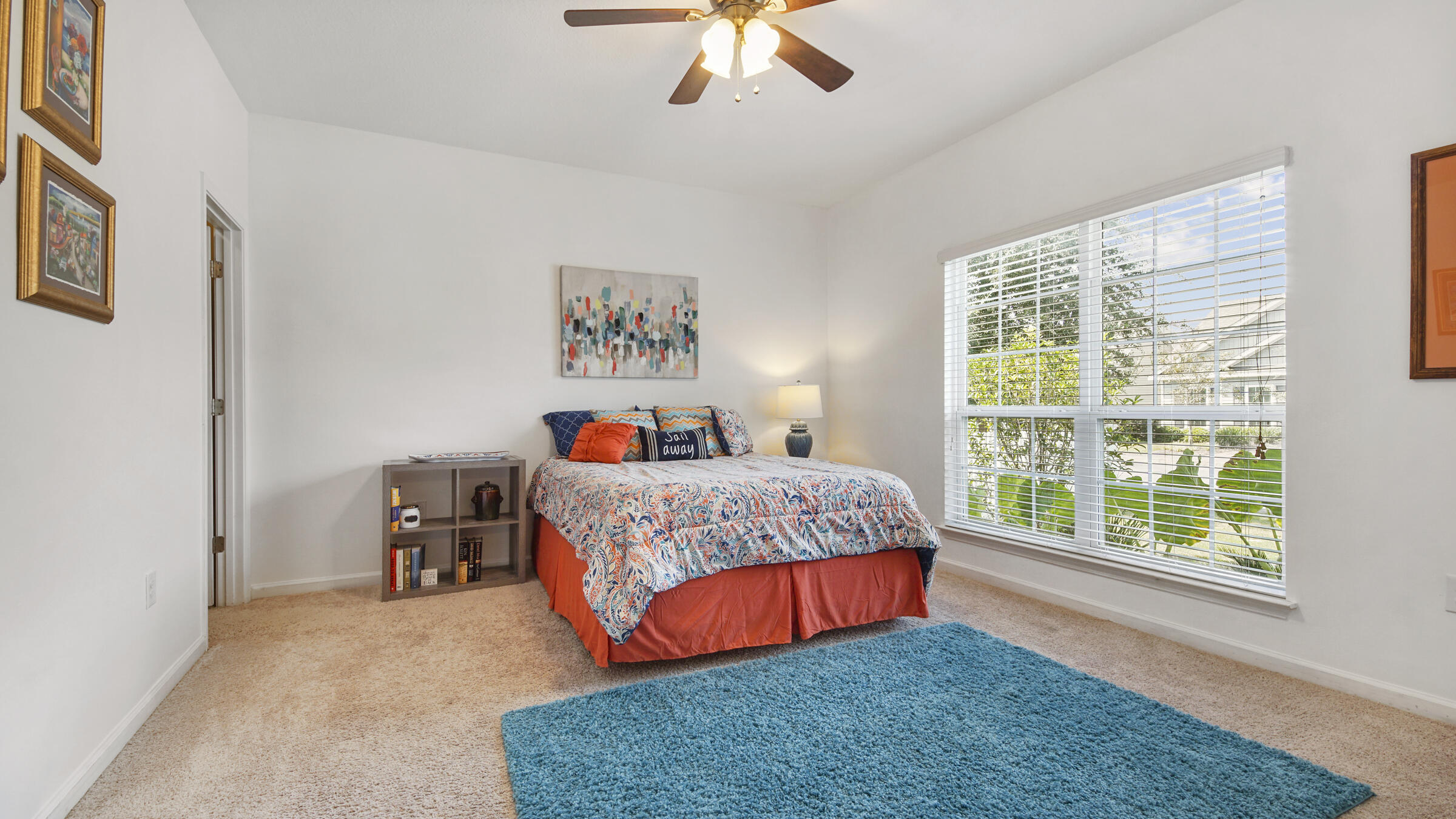 237 Nelly Street Freeport, FL 32439 - Photo 15 of 42 a bedroom with a bed and a chandelier