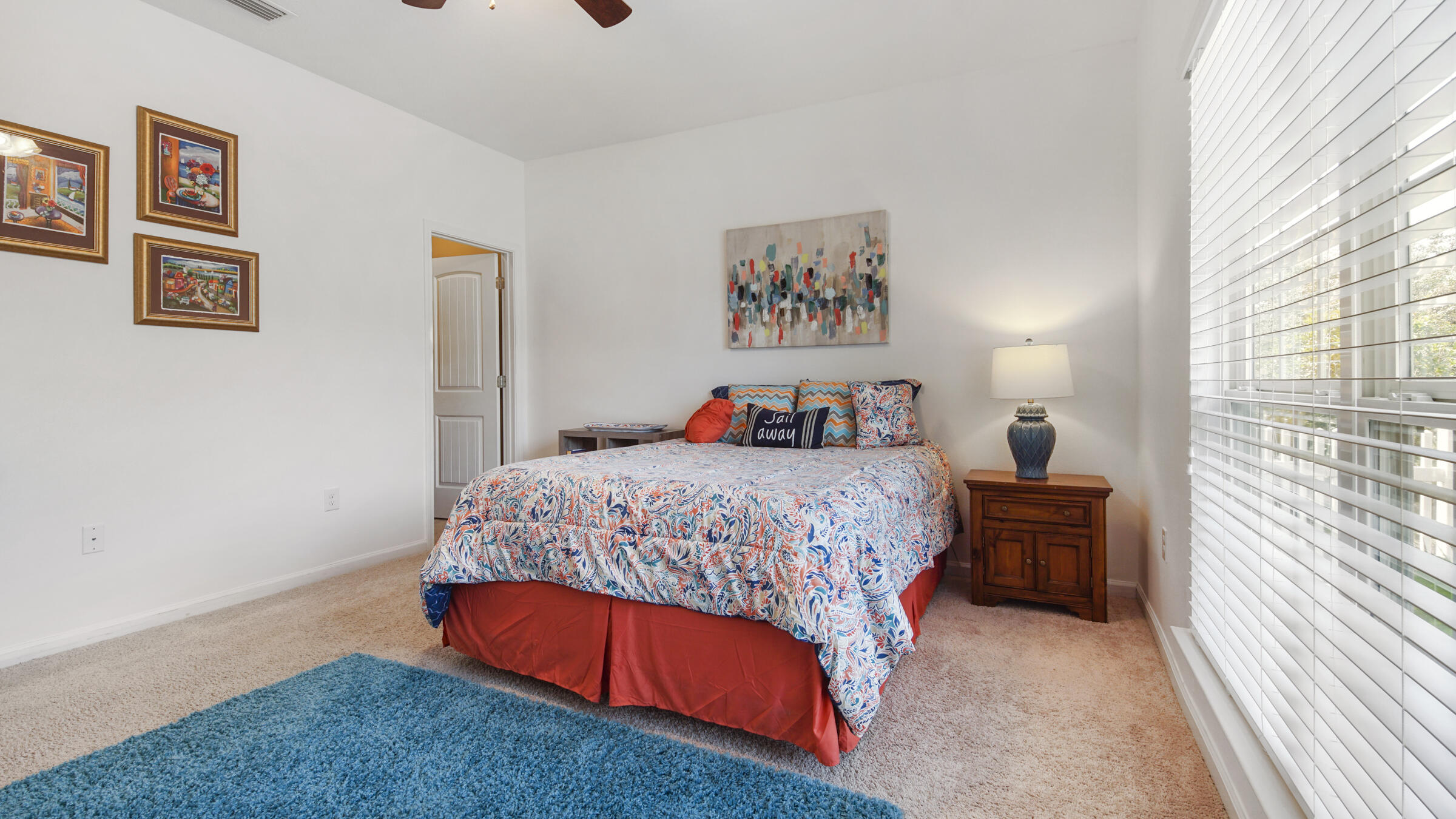 237 Nelly Street Freeport, FL 32439 - Photo 16 of 42 a bedroom with a bed and a chandelier