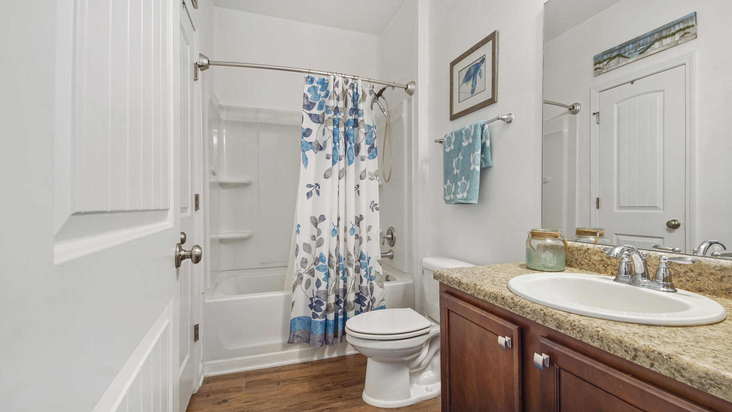 237 Nelly Street Freeport, FL 32439 - Photo 18 of 42 a bathroom with a granite countertop sink toilet and shower