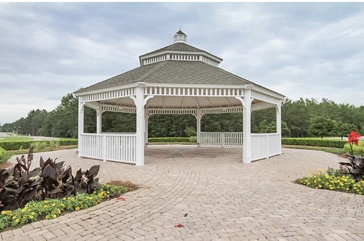 237 Nelly Street Freeport, FL 32439 - Photo 34 of 42 a view of a house with a yard and potted plants