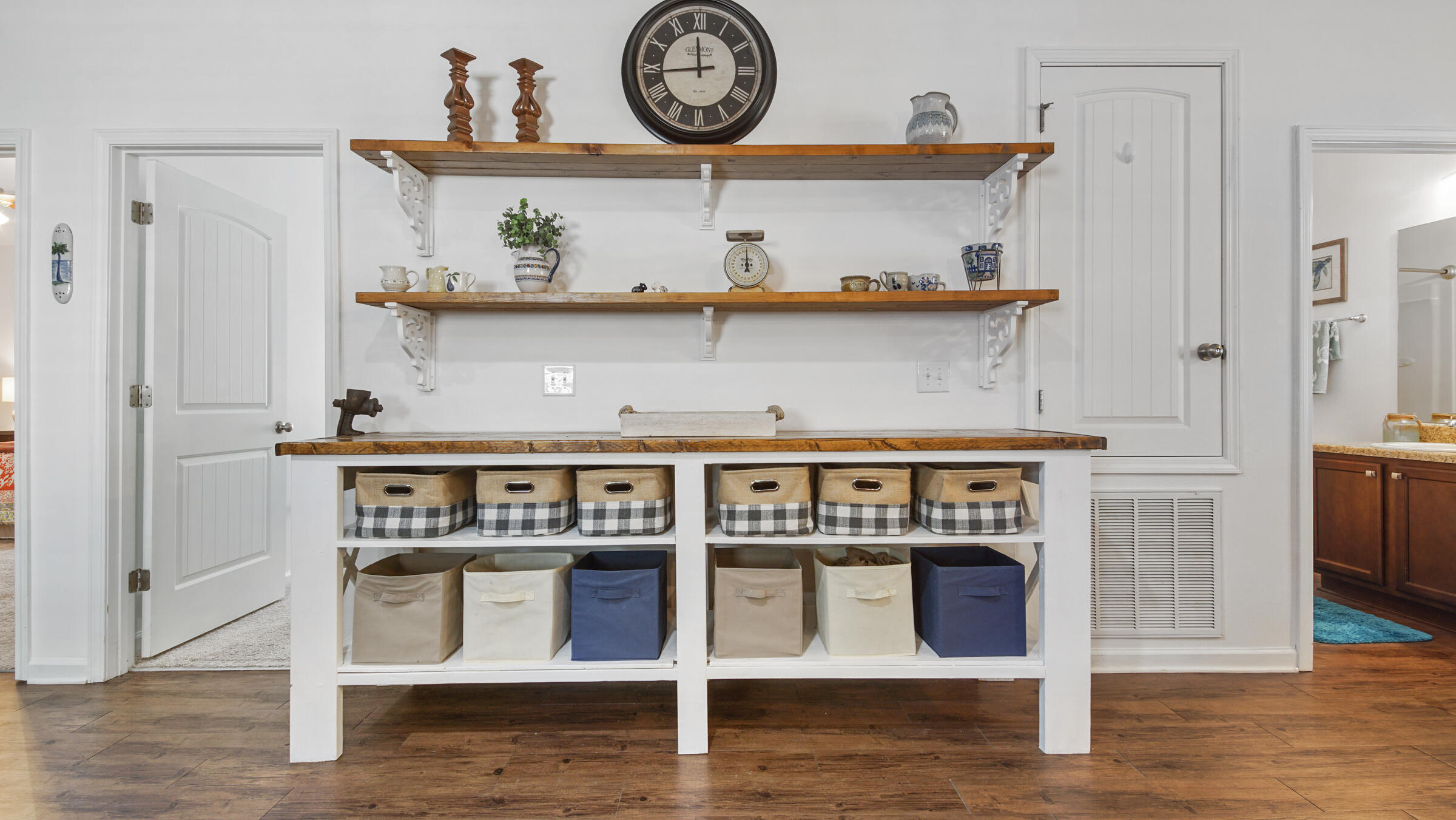 237 Nelly Street Freeport, FL 32439 - Photo 6 of 42 a view of a kitchen with a stove and wooden floor