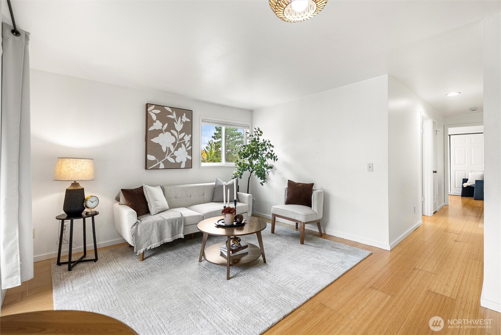 2626 East Madison Street, Unit 11 Seattle, WA 98112 - Photo 15 of 29 a living room with furniture and a lamp