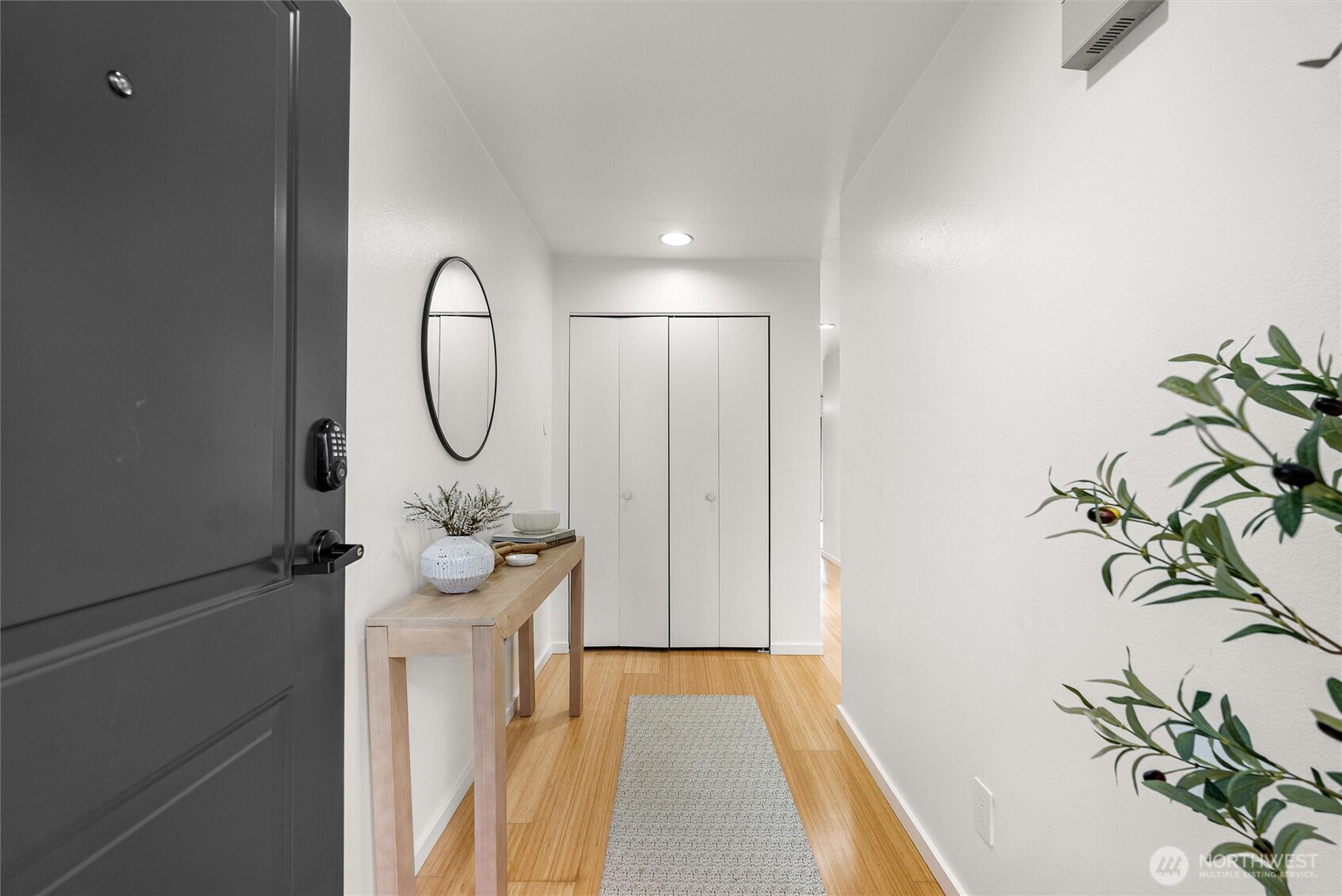 2626 East Madison Street, Unit 11 Seattle, WA 98112 - Photo 2 of 29 a view of a entryway with wooden floor