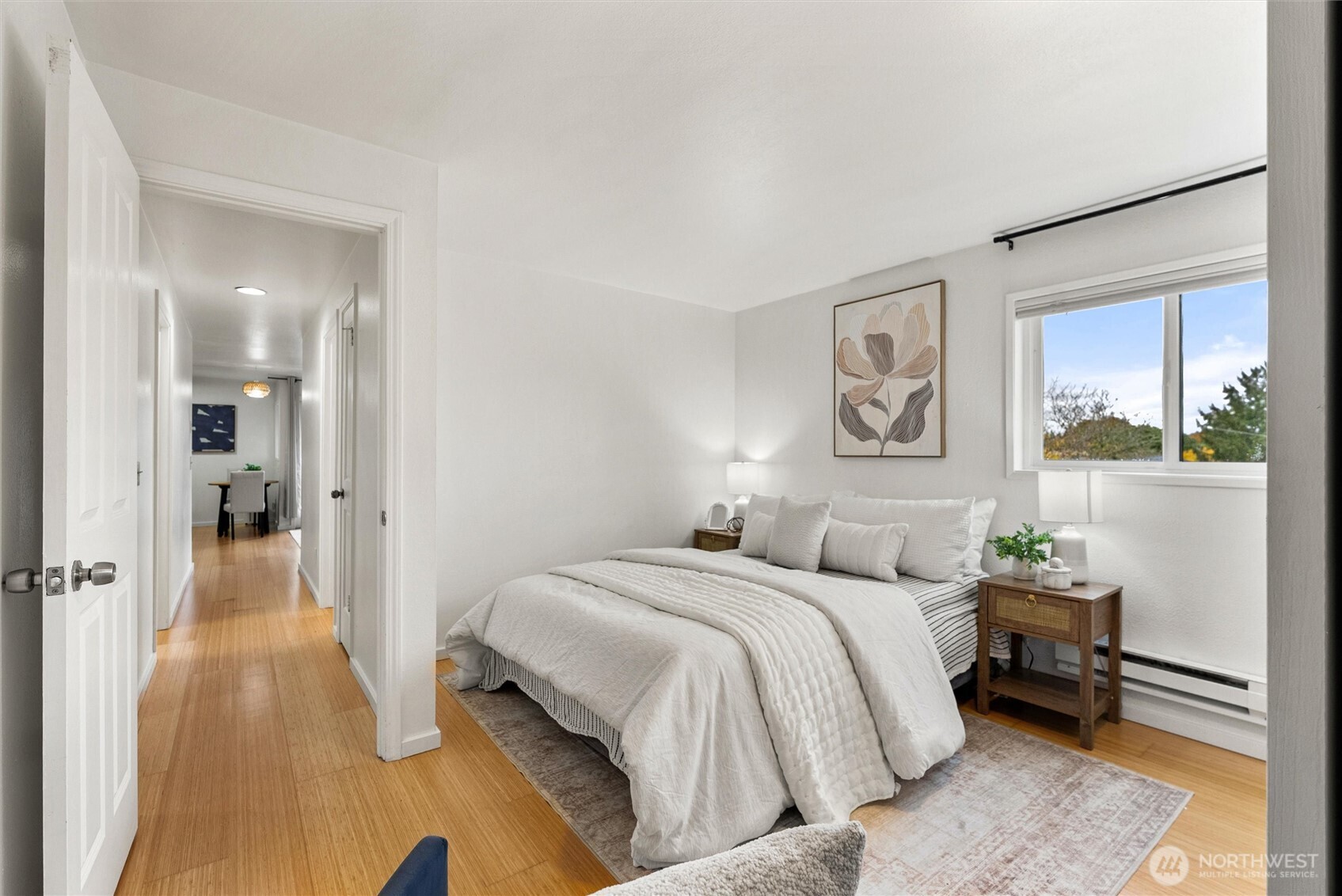 2626 East Madison Street, Unit 11 Seattle, WA 98112 - Photo 5 of 29 a bedroom with a bed and a mirror