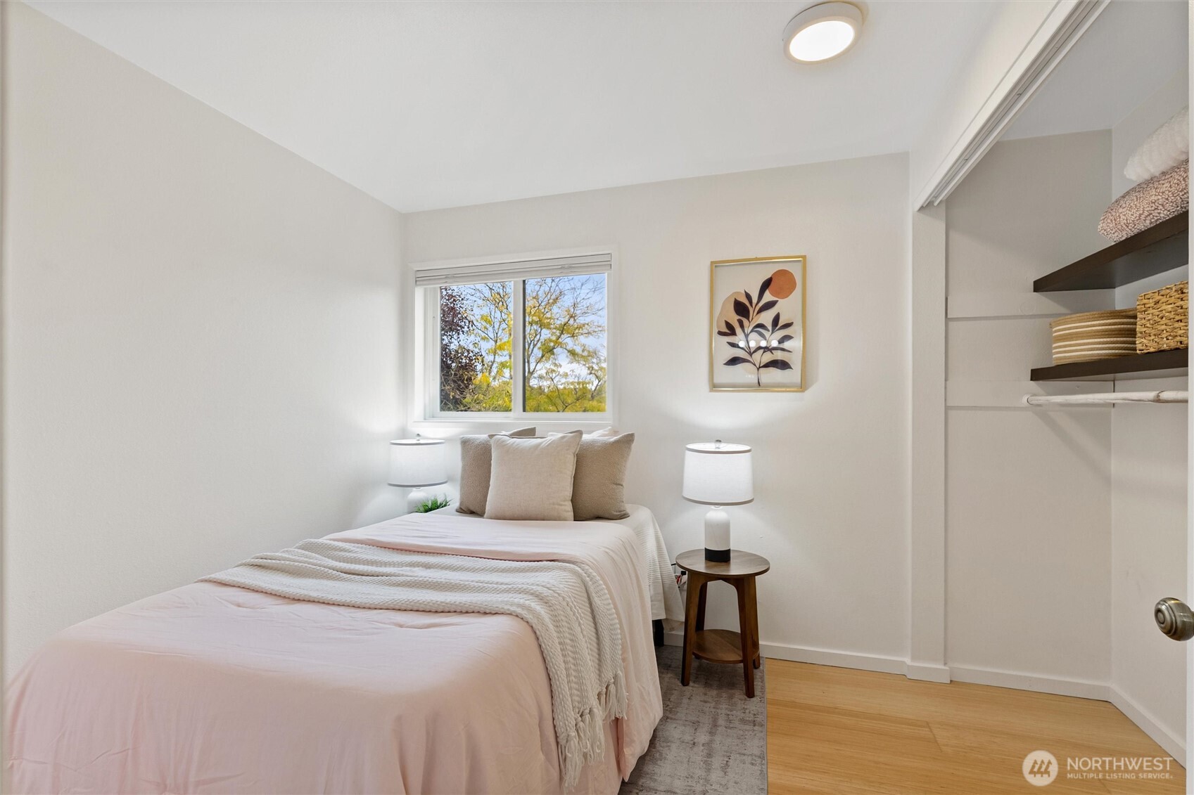 2626 East Madison Street, Unit 11 Seattle, WA 98112 - Photo 8 of 29 a bedroom with a bed and a television