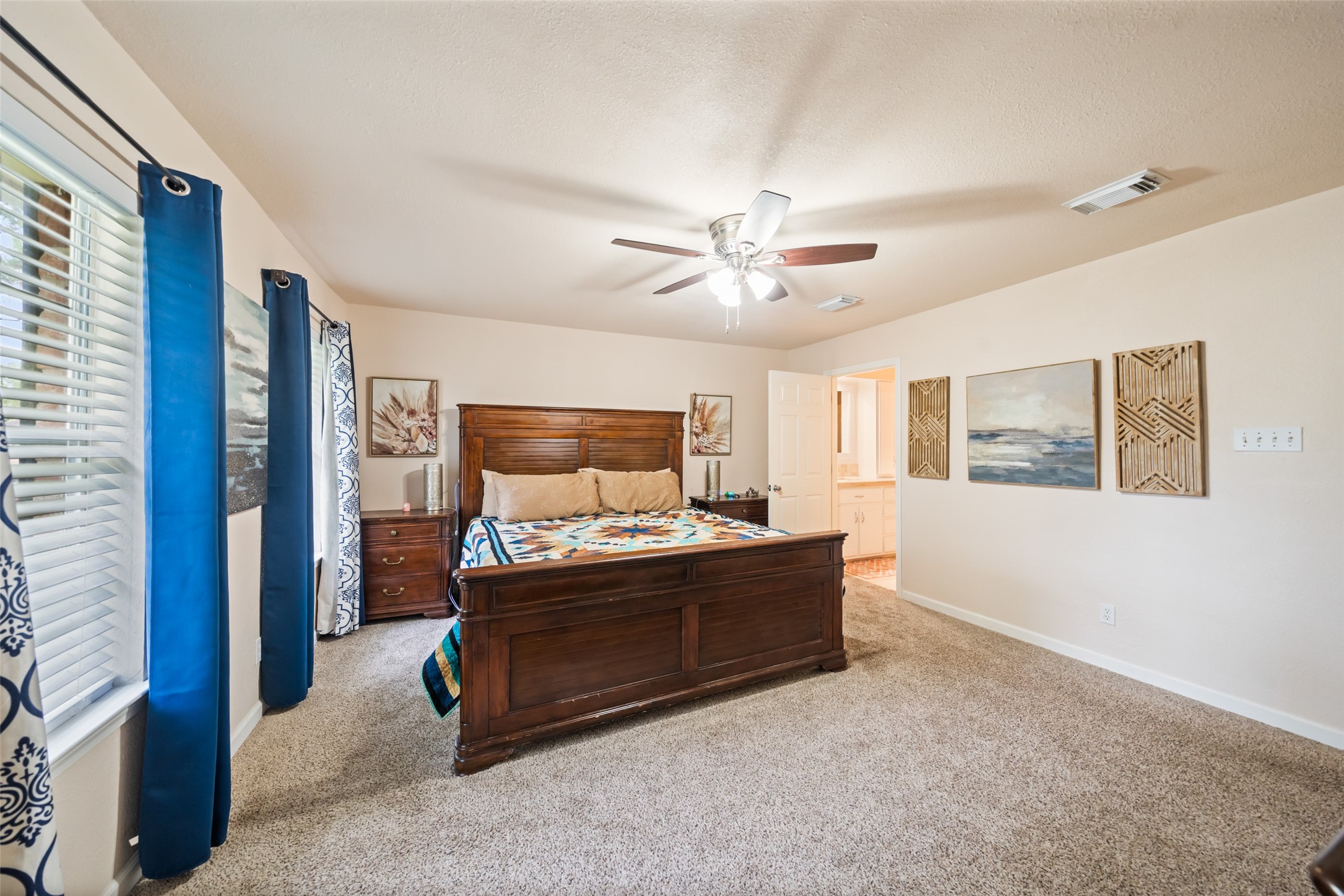 600 Hampton Hall Lane Conroe, TX 77302 - Photo 22 of 32 a bed room with furniture and a window