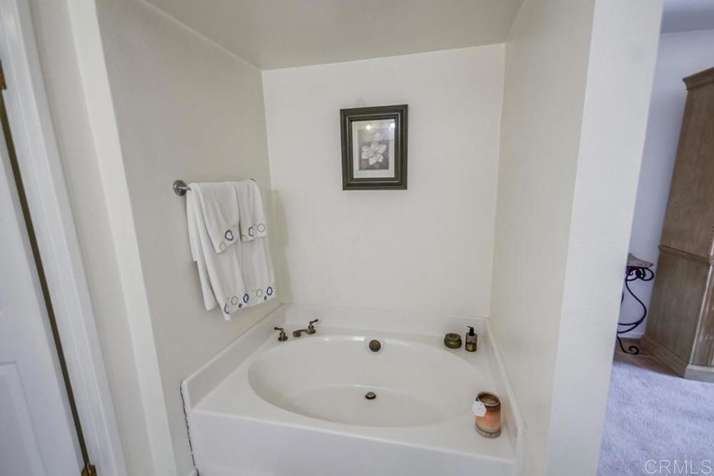 6454 Quarry Road, Unit 9 Spring Valley, CA 91977 - Photo 19 of 26 a bathroom with a bathtub