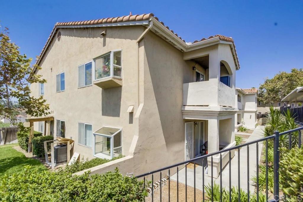 6454 Quarry Road, Unit 9 Spring Valley, CA 91977 - Photo 2 of 26 a view of a white house with large windows