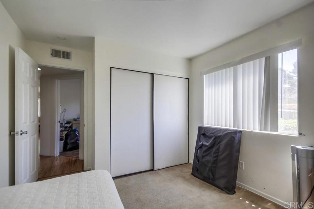 6454 Quarry Road, Unit 9 Spring Valley, CA 91977 - Photo 21 of 26 a view of a bedroom with closet area