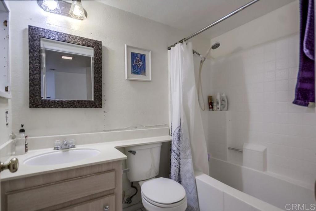 6454 Quarry Road, Unit 9 Spring Valley, CA 91977 - Photo 23 of 26 a bathroom with a sink toilet and shower