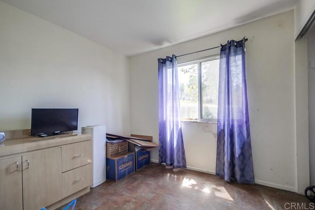 6454 Quarry Road, Unit 9 Spring Valley, CA 91977 - Photo 24 of 26 a view of a livingroom with furniture and a window
