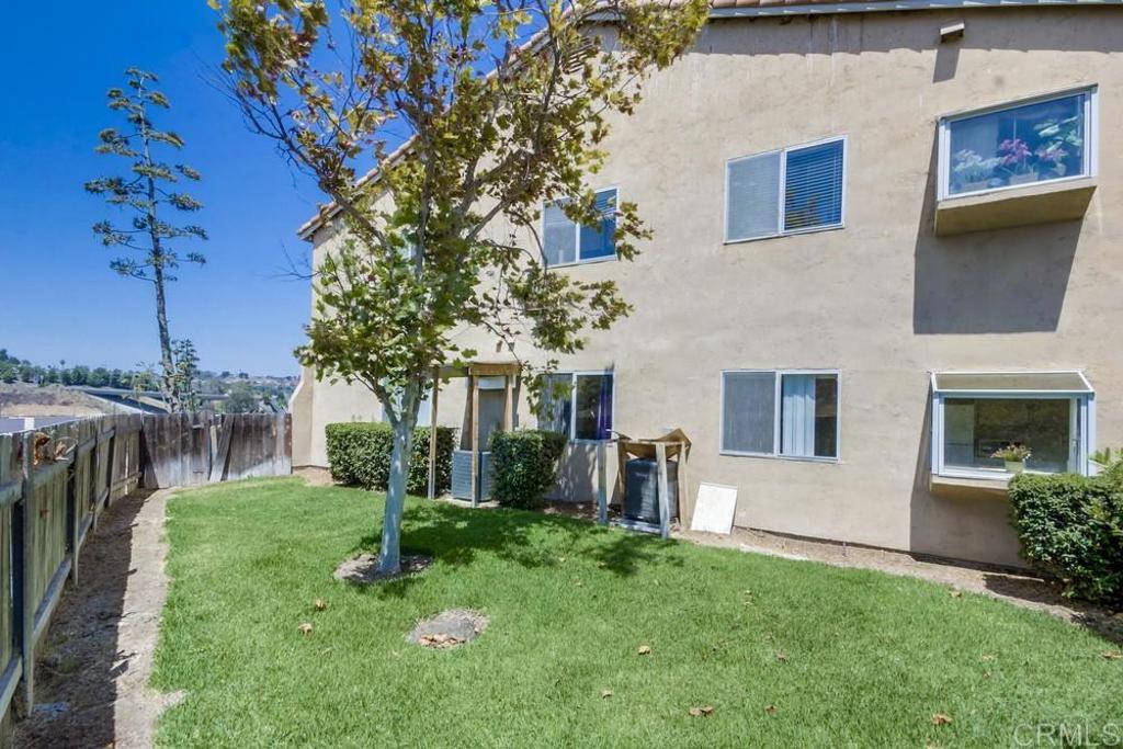 6454 Quarry Road, Unit 9 Spring Valley, CA 91977 - Photo 26 of 26 a view of a house with backyard and a tree