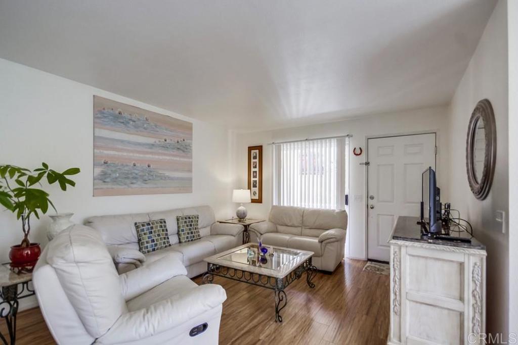 6454 Quarry Road, Unit 9 Spring Valley, CA 91977 - Photo 6 of 26 a living room with furniture and a wooden floor