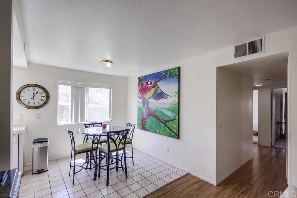 6454 Quarry Road, Unit 9 Spring Valley, CA 91977 - Photo 9 of 26 a view of a dining room with furniture window and wooden floor