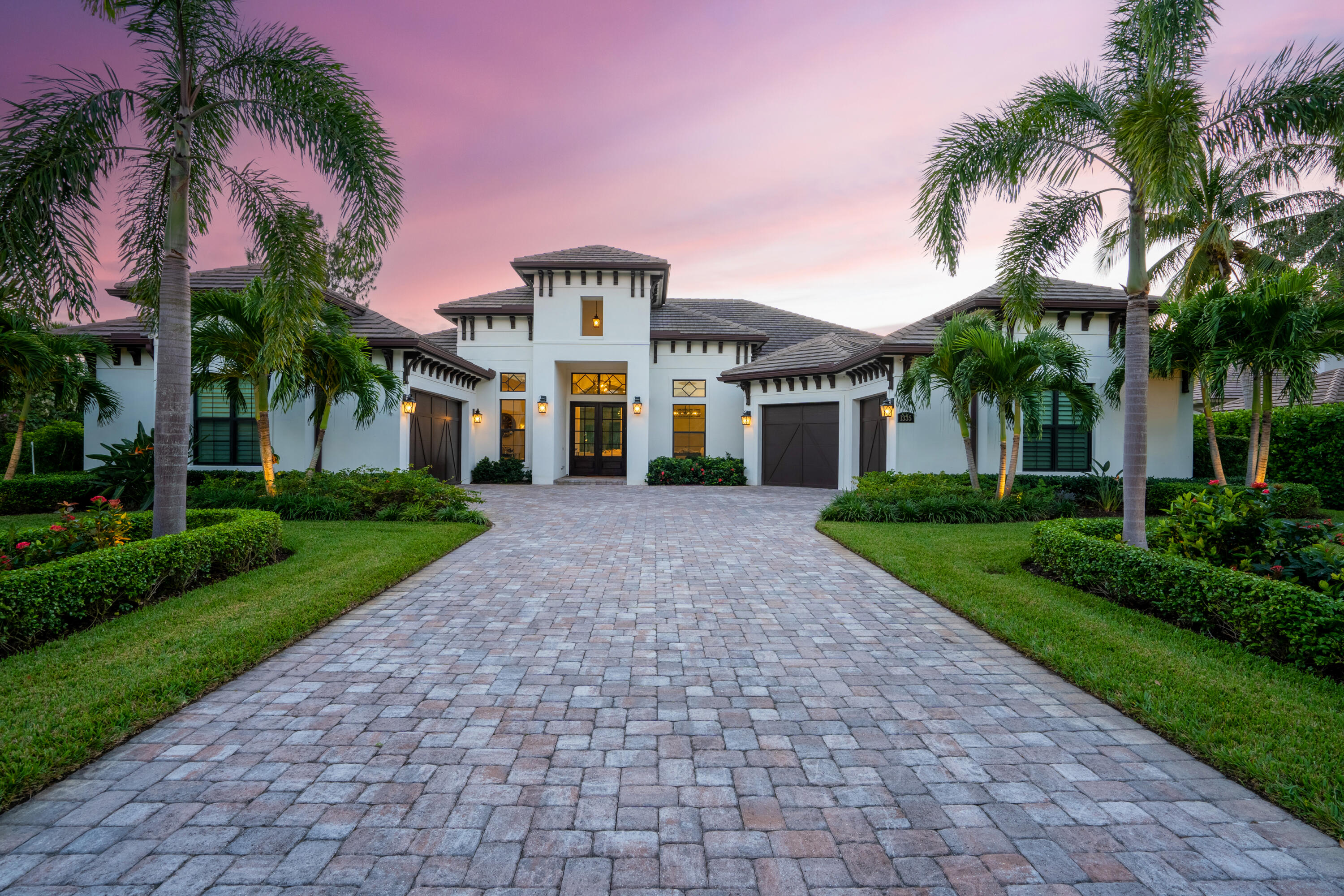 Undisclosed Address Vero Beach, FL 32963 - Photo 1 of 1 a front view of a house with a garden and palm trees