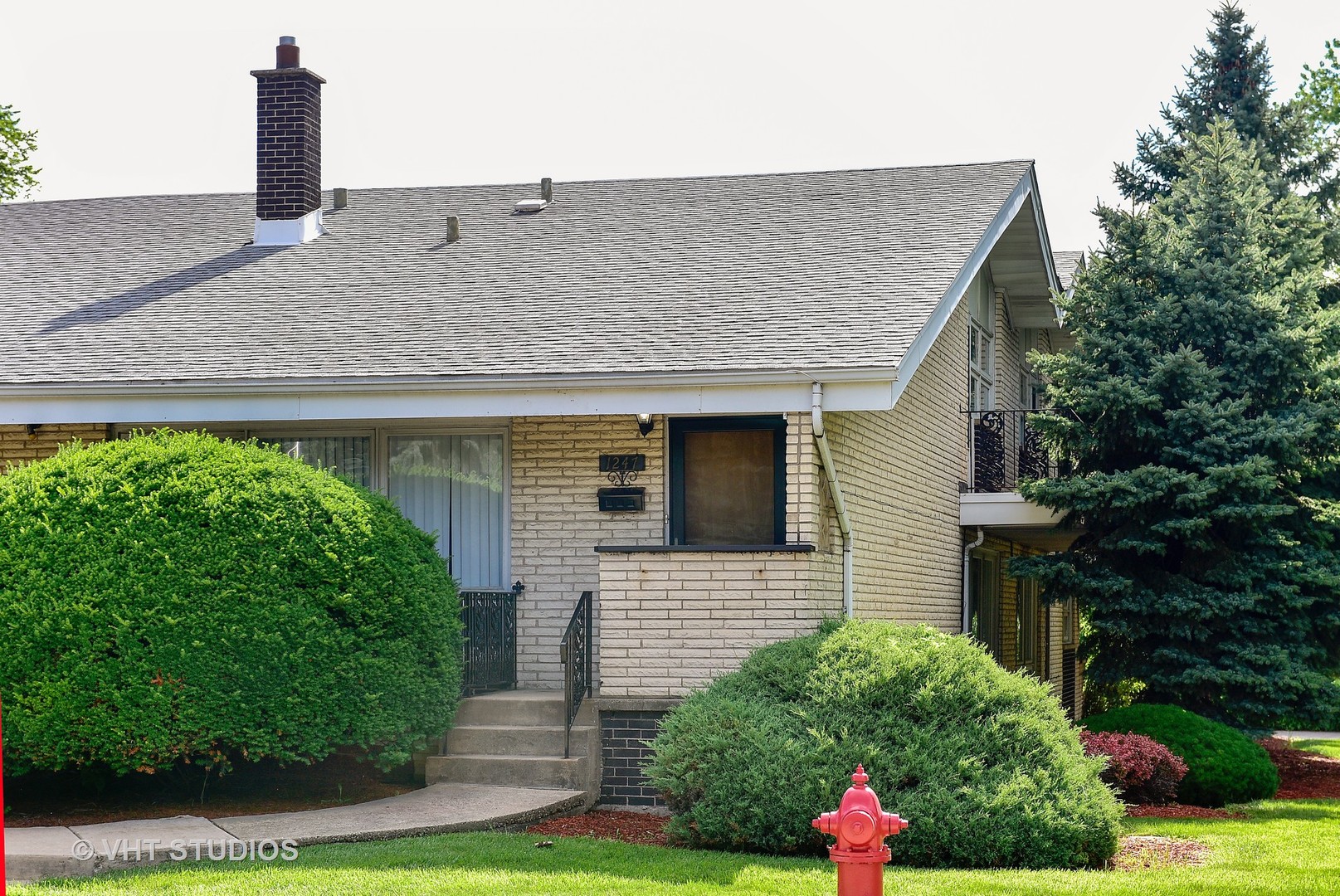 1247 South Mannheim Road, Unit 3 Westchester, IL 60154 - Photo 1 of 12 a front view of a house with a yard