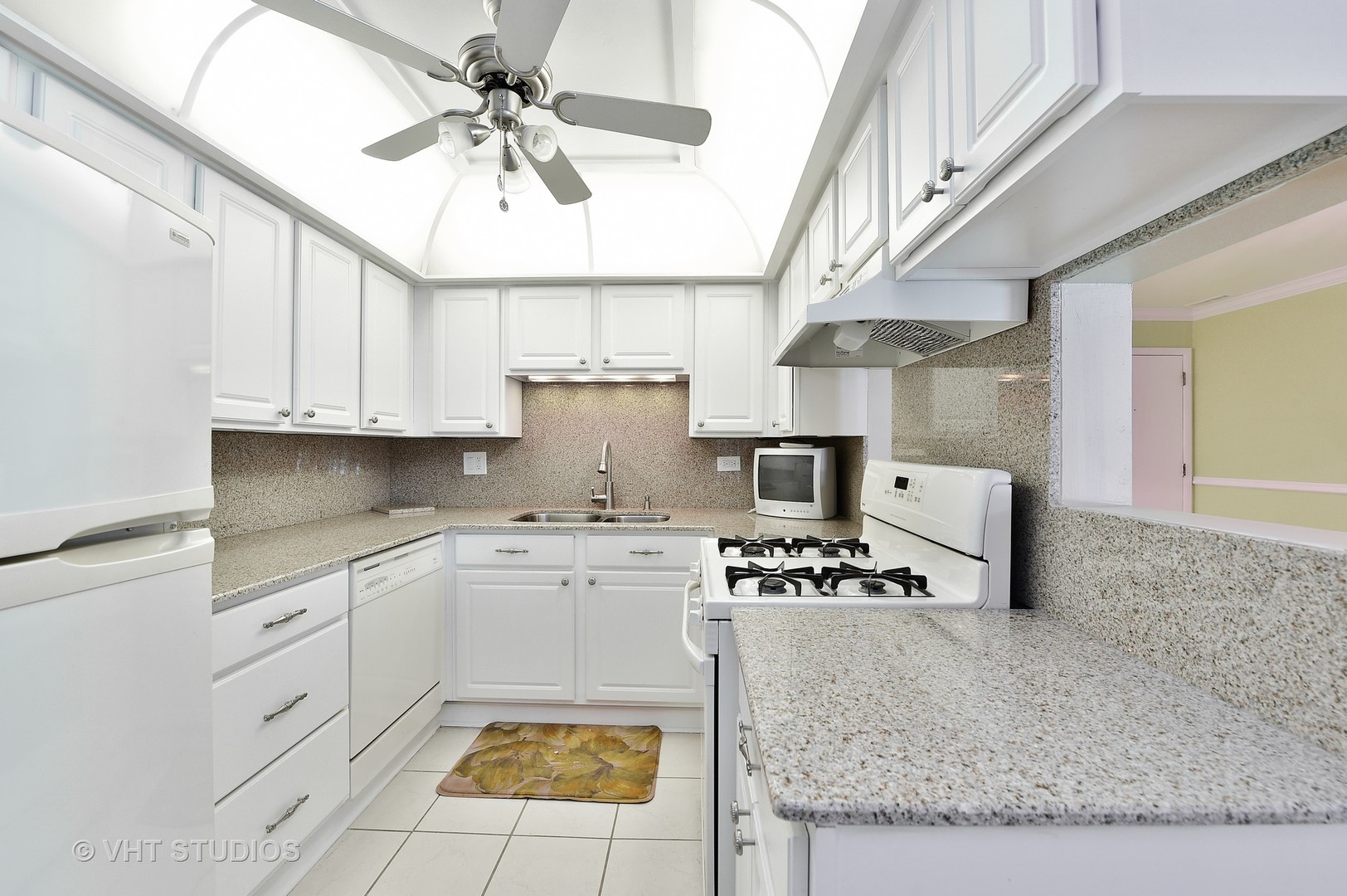 1247 South Mannheim Road, Unit 3 Westchester, IL 60154 - Photo 4 of 12 a kitchen with stainless steel appliances granite countertop a sink a stove and cabinets