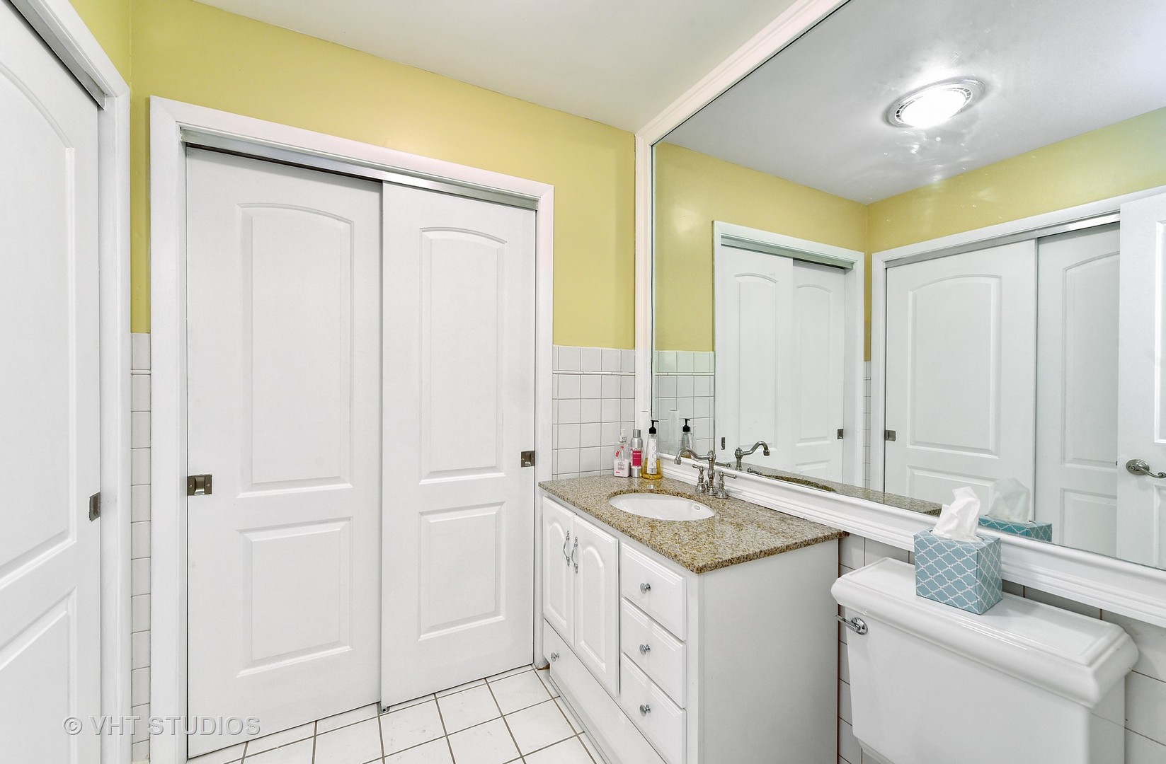 1247 South Mannheim Road, Unit 3 Westchester, IL 60154 - Photo 9 of 12 a bathroom with a granite countertop sink and a mirror