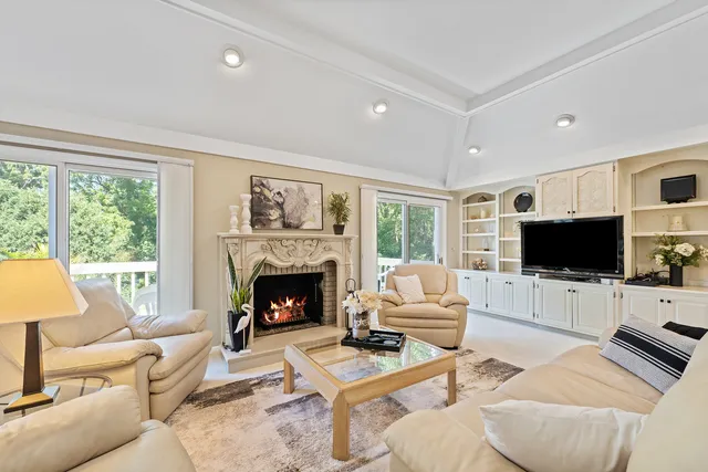 a view of a dining room with furniture and a large window
