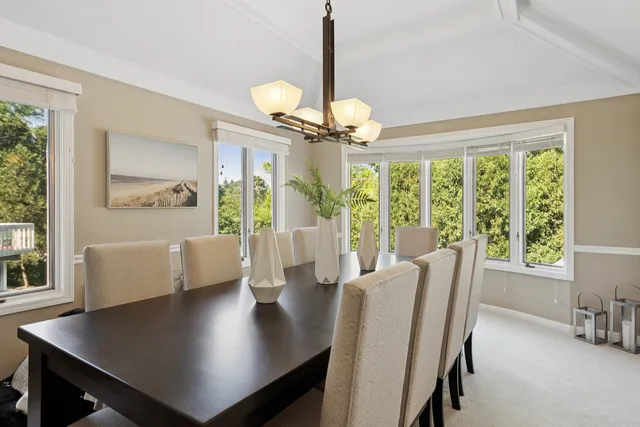 a utility room with cabinets dryer and washer