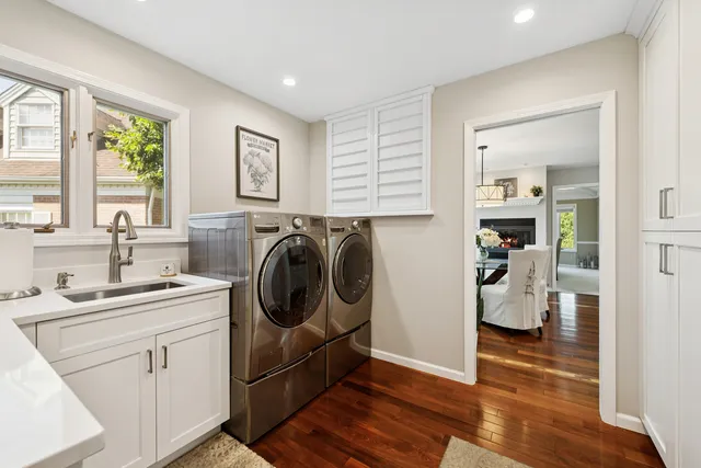 a view of kitchen with wooden floor and cabinet