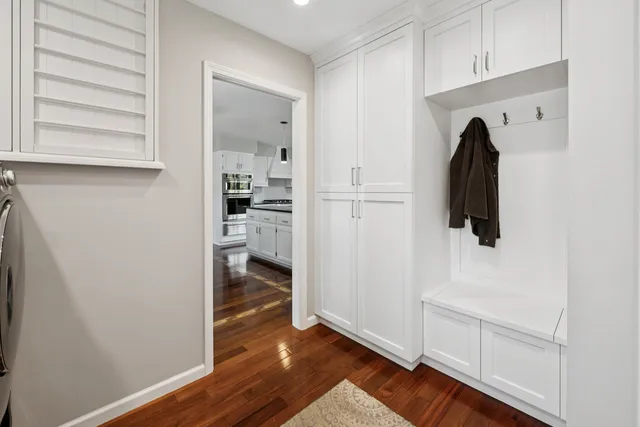 a view of a dining room with furniture wooden floor and chandelier