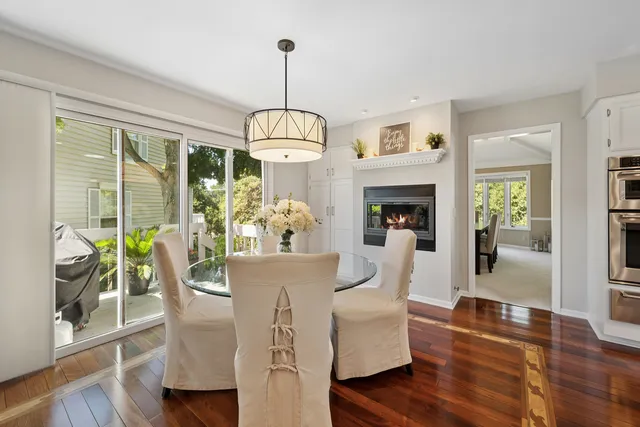 a kitchen with granite countertop stainless steel appliances a counter top space and cabinets