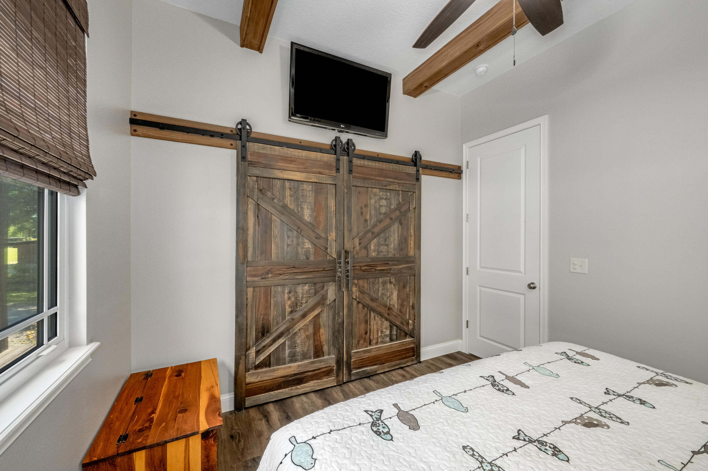 4600 Dixie Way Mims, FL 32754 - Photo 19 of 86 a bed room with a bed and a television